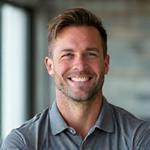 Mark Johnson, a friendly fitness coach with an athletic build.